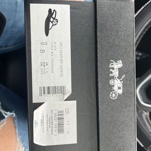 NIB black leather coach sandals.Women’s size 9. Never been worn.Smoke free home